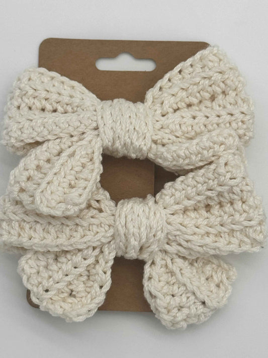 Handcrafted crochet bow hair accessory by C2 Creations LLC, featuring a colorful, textured crochet bow for stylish hair decoration.