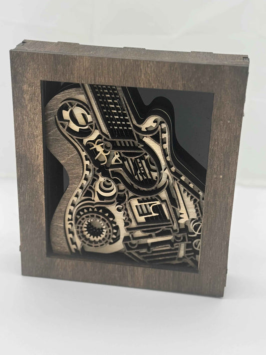 Layered wood 3D guitar shadow box art, musical room decor by C2 Creations LLC, featuring detailed guitar design and artistic craftsmanship.