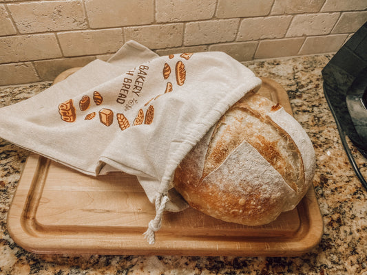 Onic Brands LLC bread bag for storing baked goods, featuring a durable fabric and clear branding on the front.