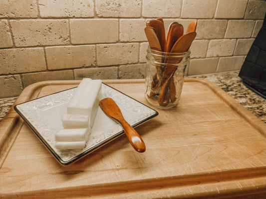 Onic Brands wooden butter knife with smooth handle and rounded blade for spreading butter or soft spreads.