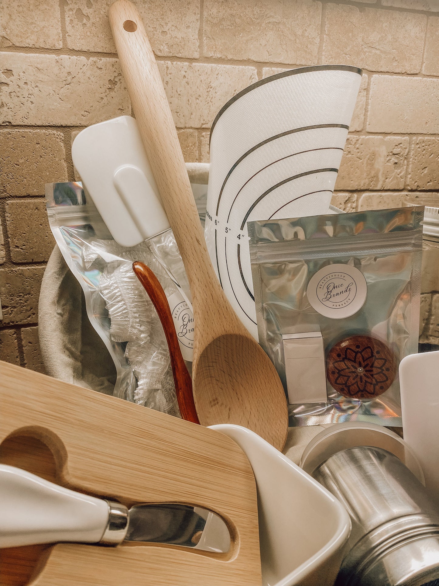 Onic Brands kitchen spatula with black handle and stainless steel head, ideal for cooking and flipping food on stove.