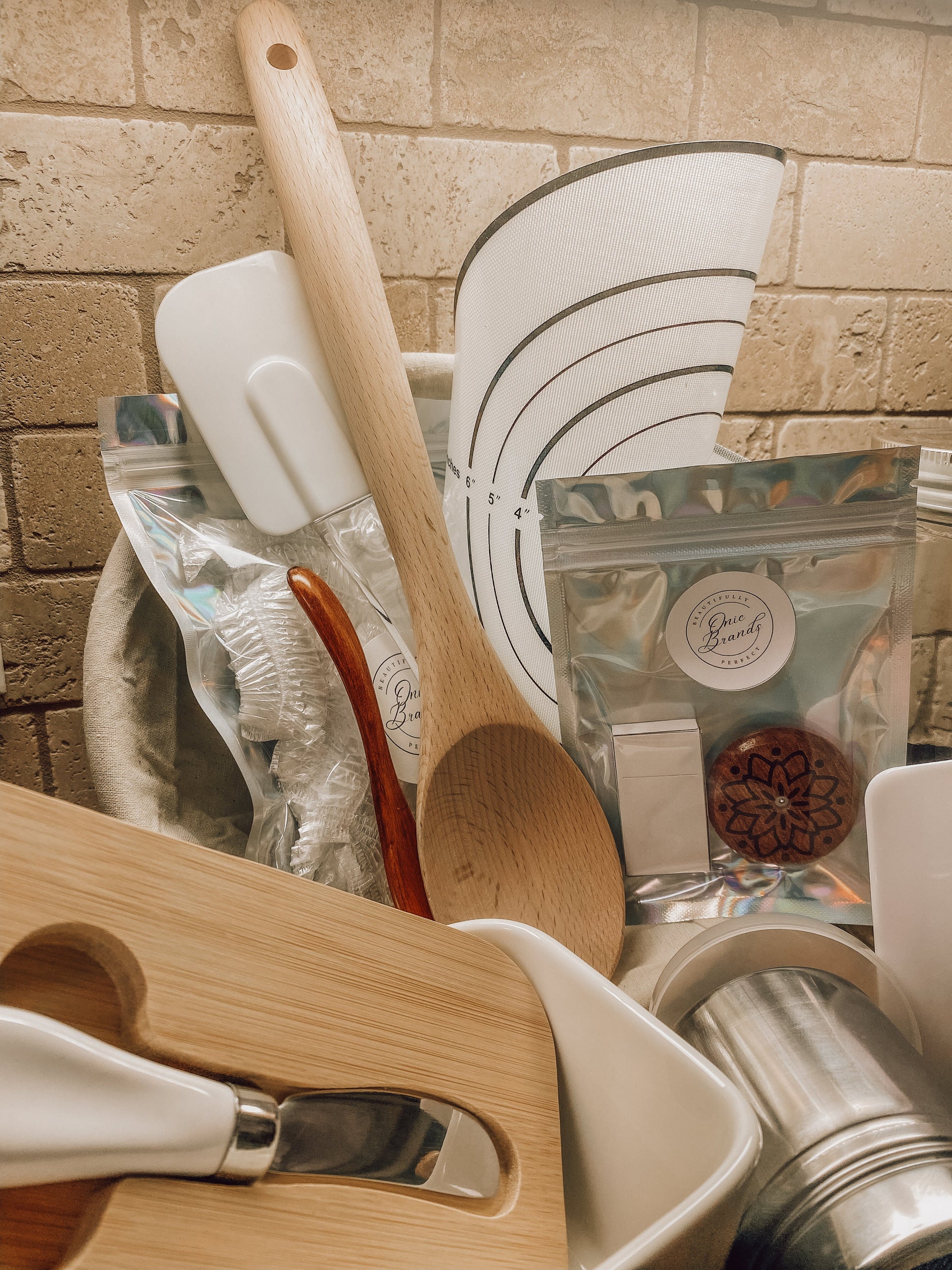 Onic Brands kitchen spatula with black handle and stainless steel head, ideal for cooking and flipping food on stove.