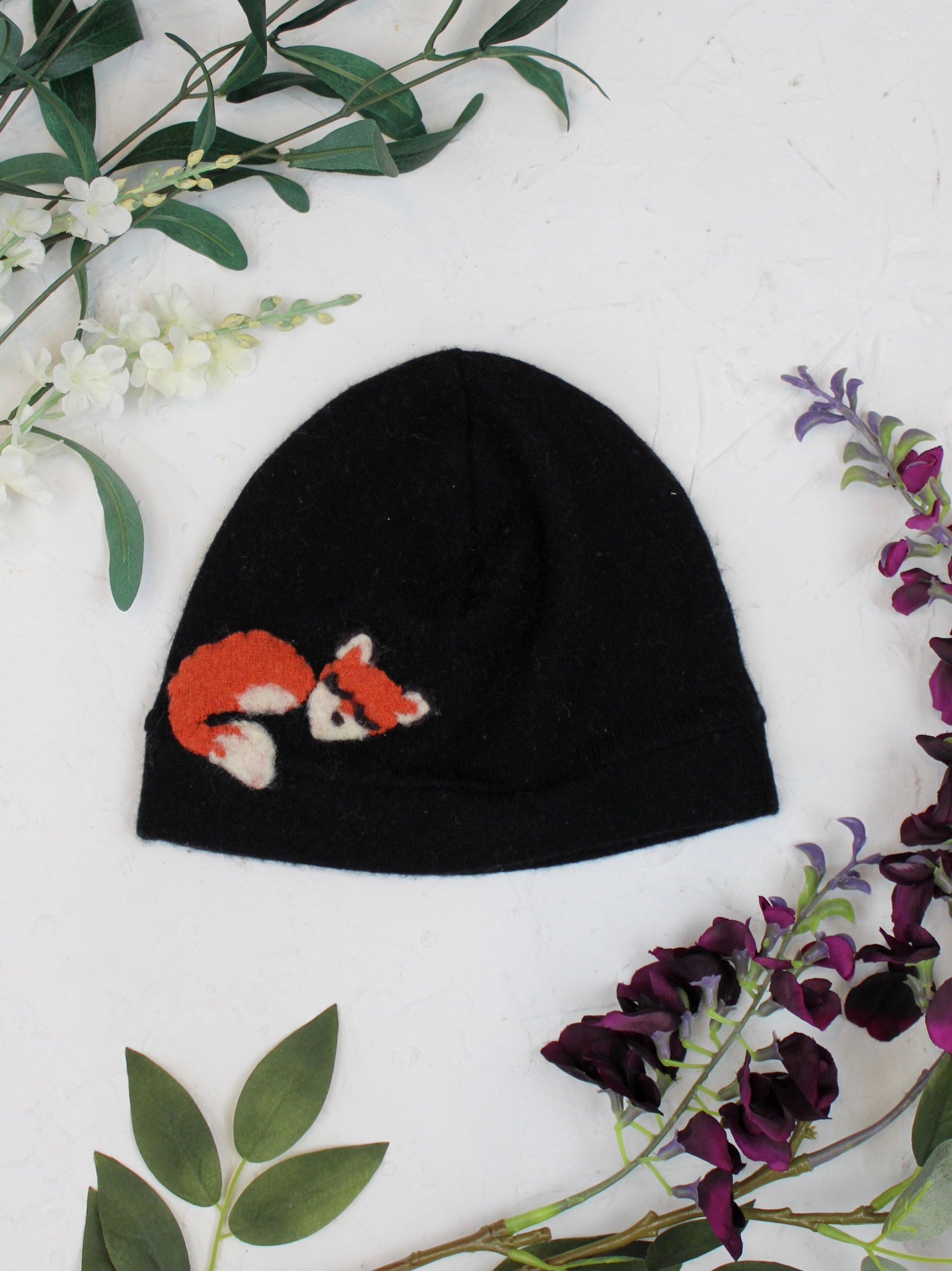 Child wearing Ash & Rose Sleeping Fox Cashmere Hat, soft cozy winter hat with fox design for kids.