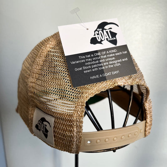 Bloom distressed mesh snapback baseball cap by The Goat Stock, featuring a distressed mesh design and adjustable snapback closure.