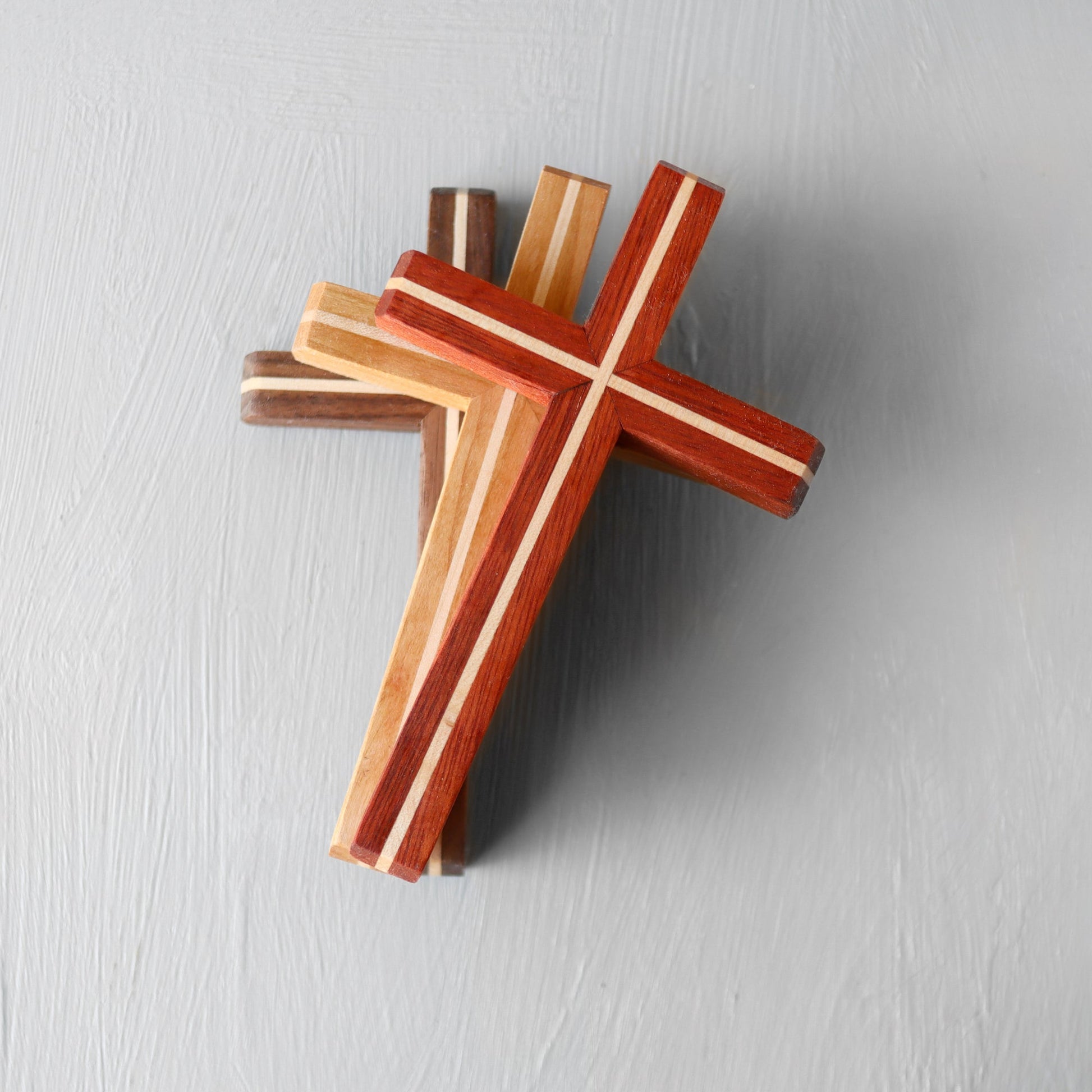 Wooden Thinline Cross by Dennehey Design Co. featuring a sleek, minimalist design with smooth, natural wood grain details.