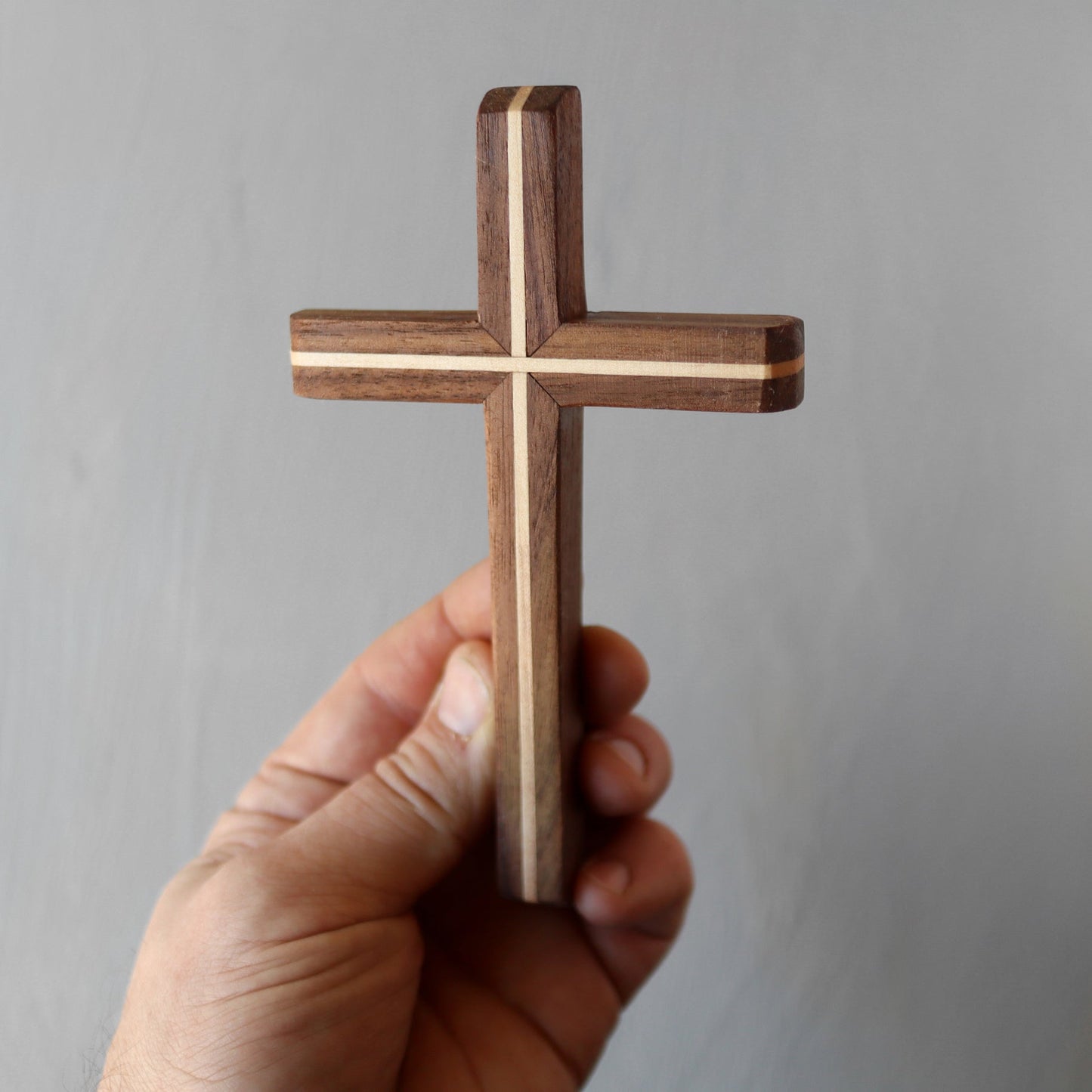 Wooden Thinline Cross by Dennehey Design Co. with smooth, elegant design, showcasing craftsmanship and natural wood grain.