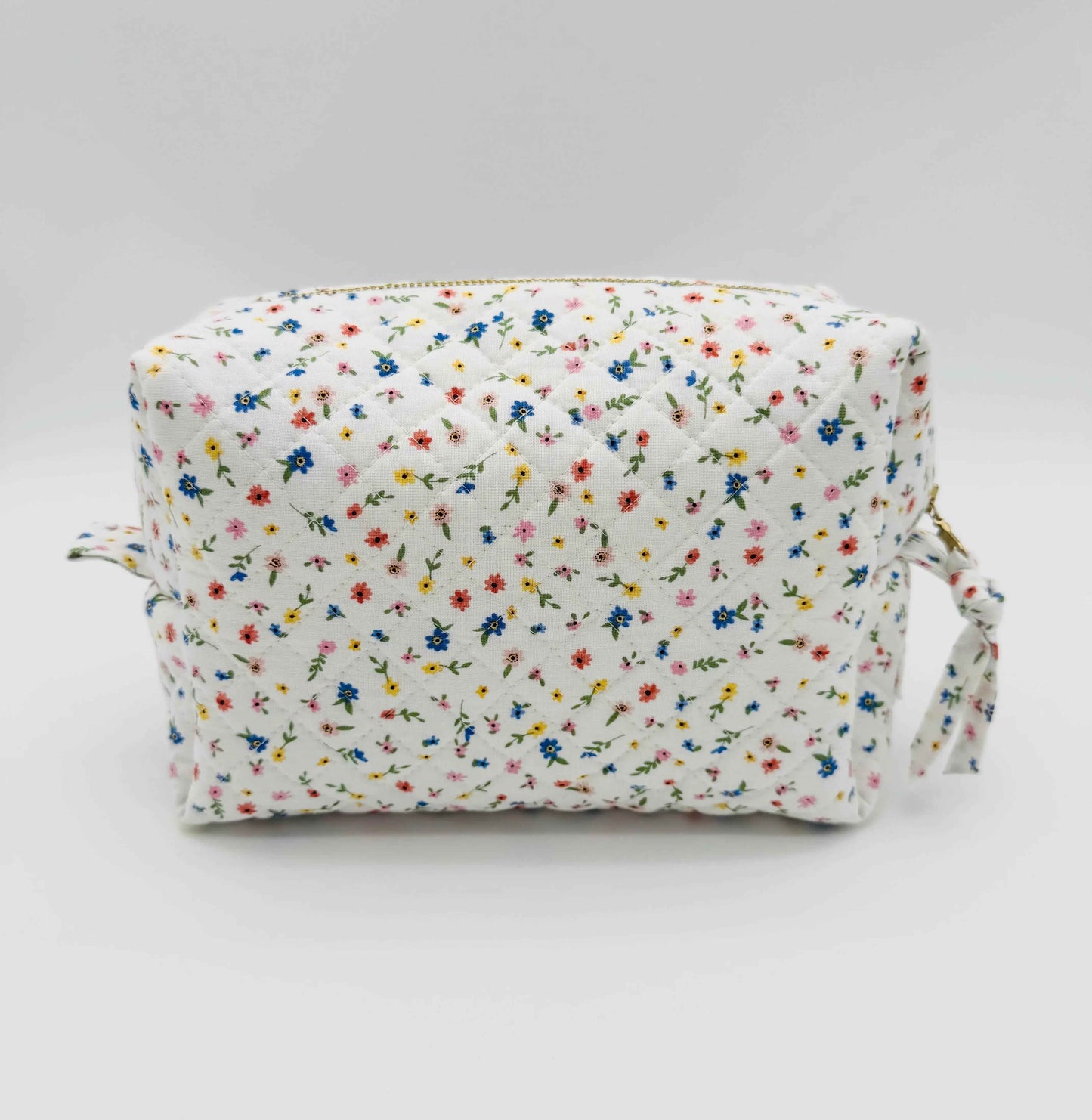 Handmade boxy makeup bag by C2 Creations LLC with wildflower meadow pattern, stylish toiletry storage with floral design.