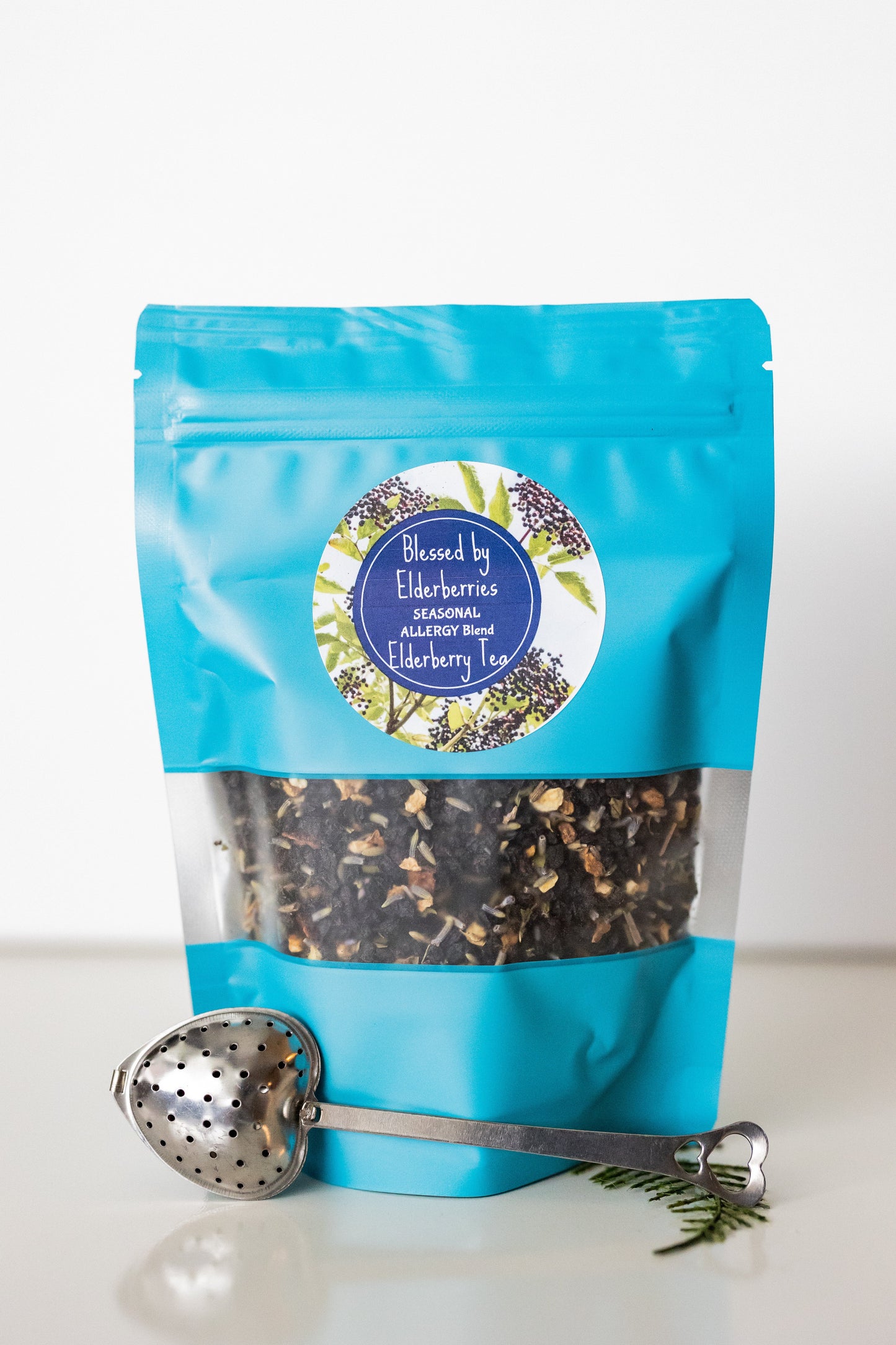 Loose leaf Elderberry Tea from Blessed by Elderberries, seasonal allergy blend with dried elderberries and herbs in a glass jar.