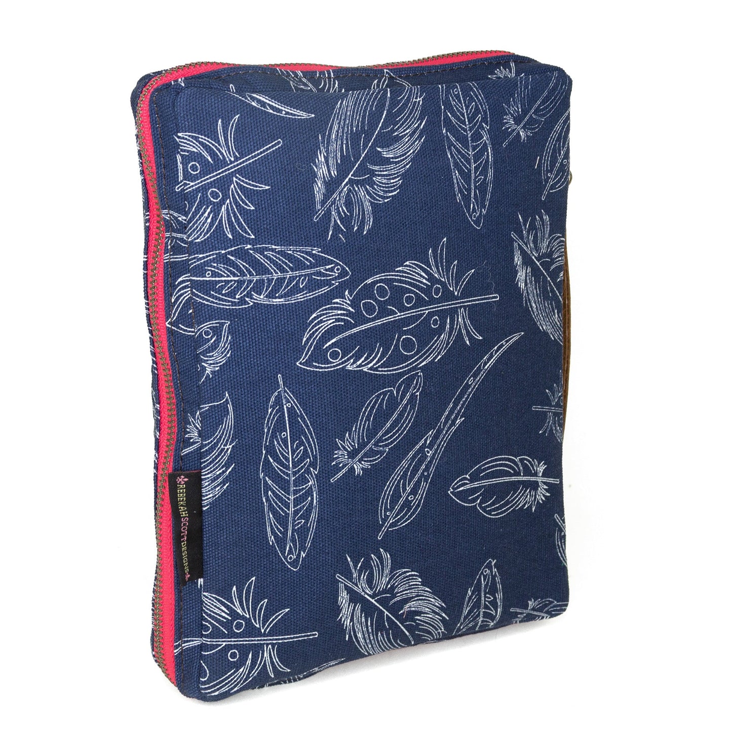 Indigo feather-patterned slim Bible cover by Rebekah Scott Designs, featuring a soft fabric exterior and secure zipper closure.