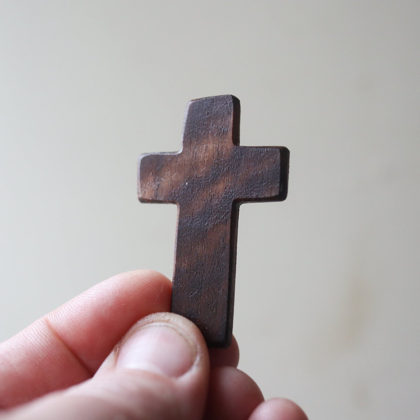 Wooden Thin Pocket Cross by Dennehey Design Co. featuring a sleek, minimalist design perfect for personal or decorative use.