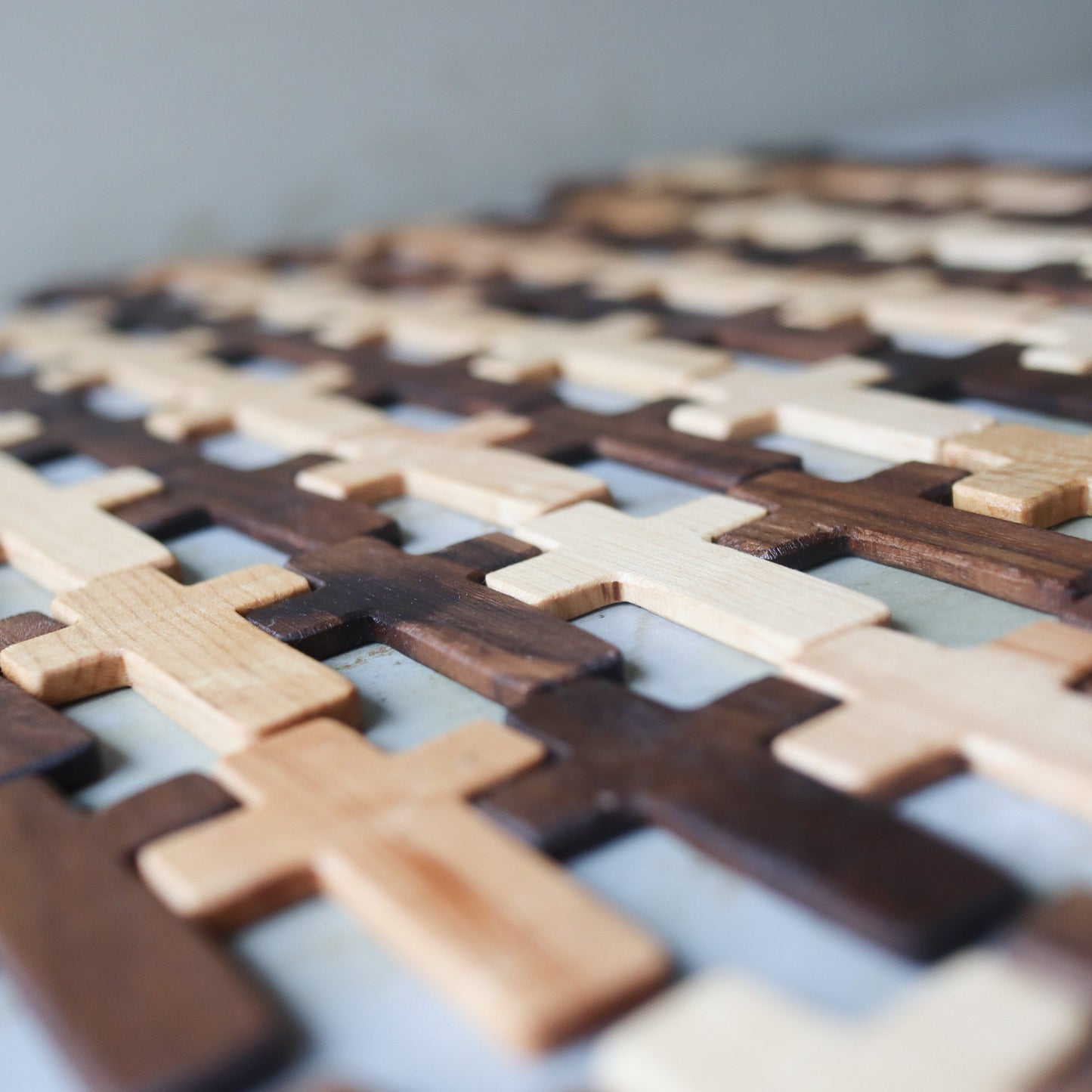 Wooden Thin Pocket Cross by Dennehey Design Co. featuring a sleek, minimalist design perfect for carrying as a spiritual accessory.