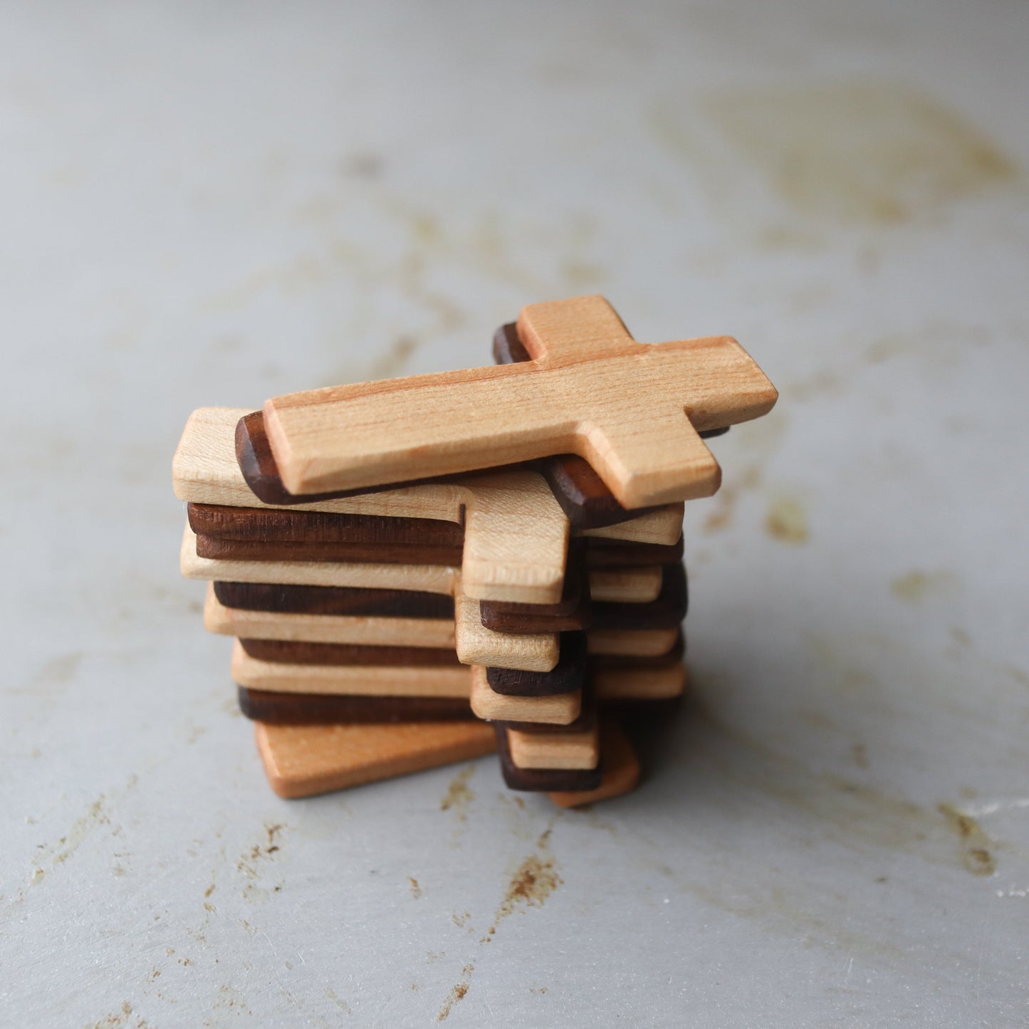 Wooden Thin Pocket Cross by Dennehey Design Co. featuring a sleek, minimalist design perfect for personal or decorative use.