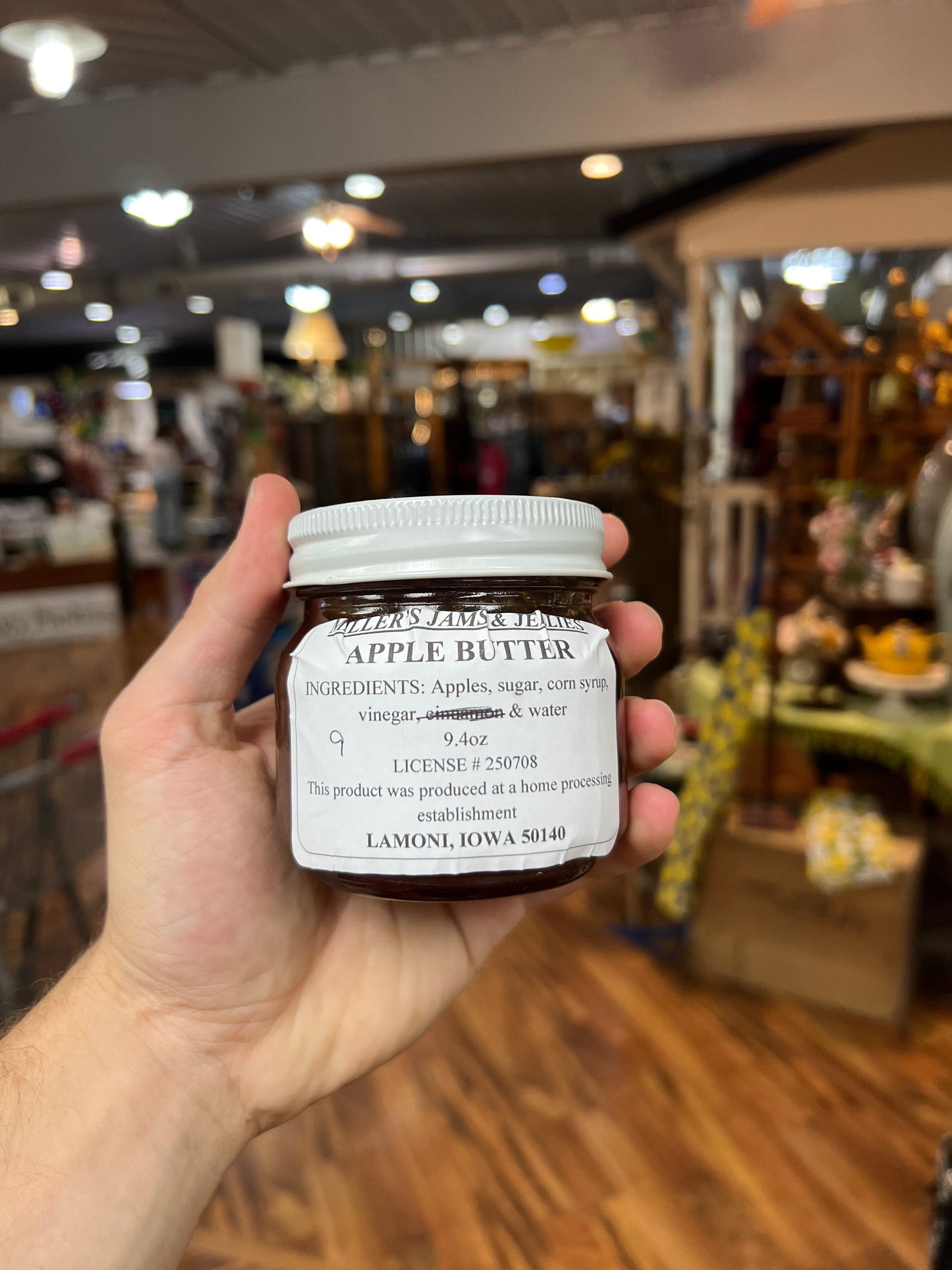 Amish Country Store Miller's Apple Butter jar with label, showcasing the Amish-made apple jam in a clear glass jar.