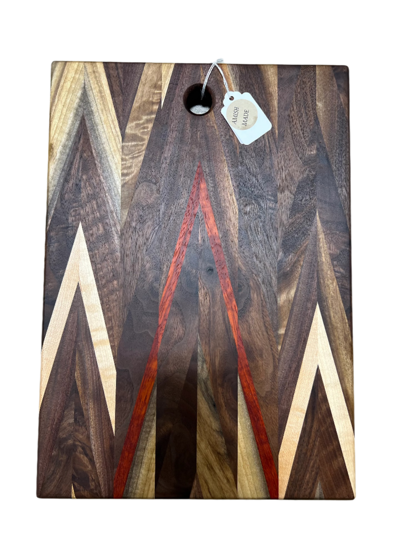 Handcrafted Amish Chevron cutting board with multi-wood inlay and beeswax finish, measuring 9.5 x 14 inches, in a kitchen setting.