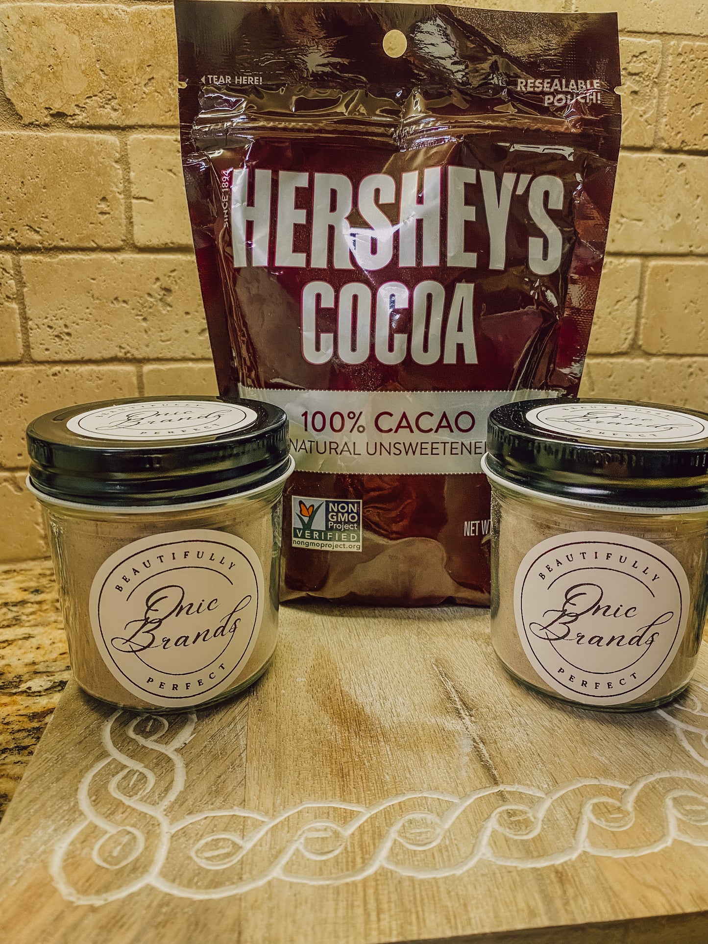 Onic Brands Hot Cocoa Mix in a box, showing the rich chocolate powder and packaging for a warm beverage drink.