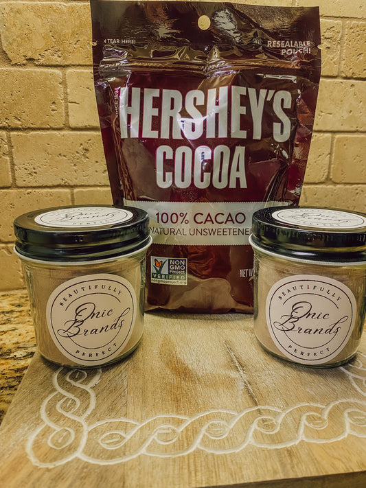 Onic Brands Hot Cocoa Mix in a jar, ready to be prepared as a warm chocolate drink, with cocoa powder visible inside the jar.