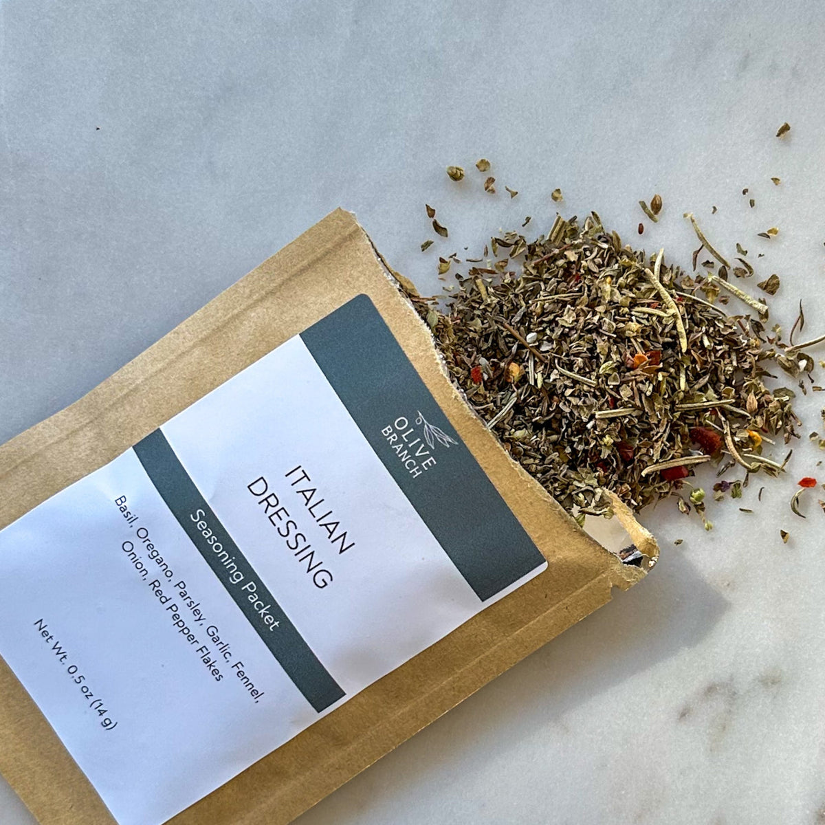 Italian Dressing seasoning blend packet by Olive Branch Oil & Spice, showcasing a colorful spice mix for salads and marinades.