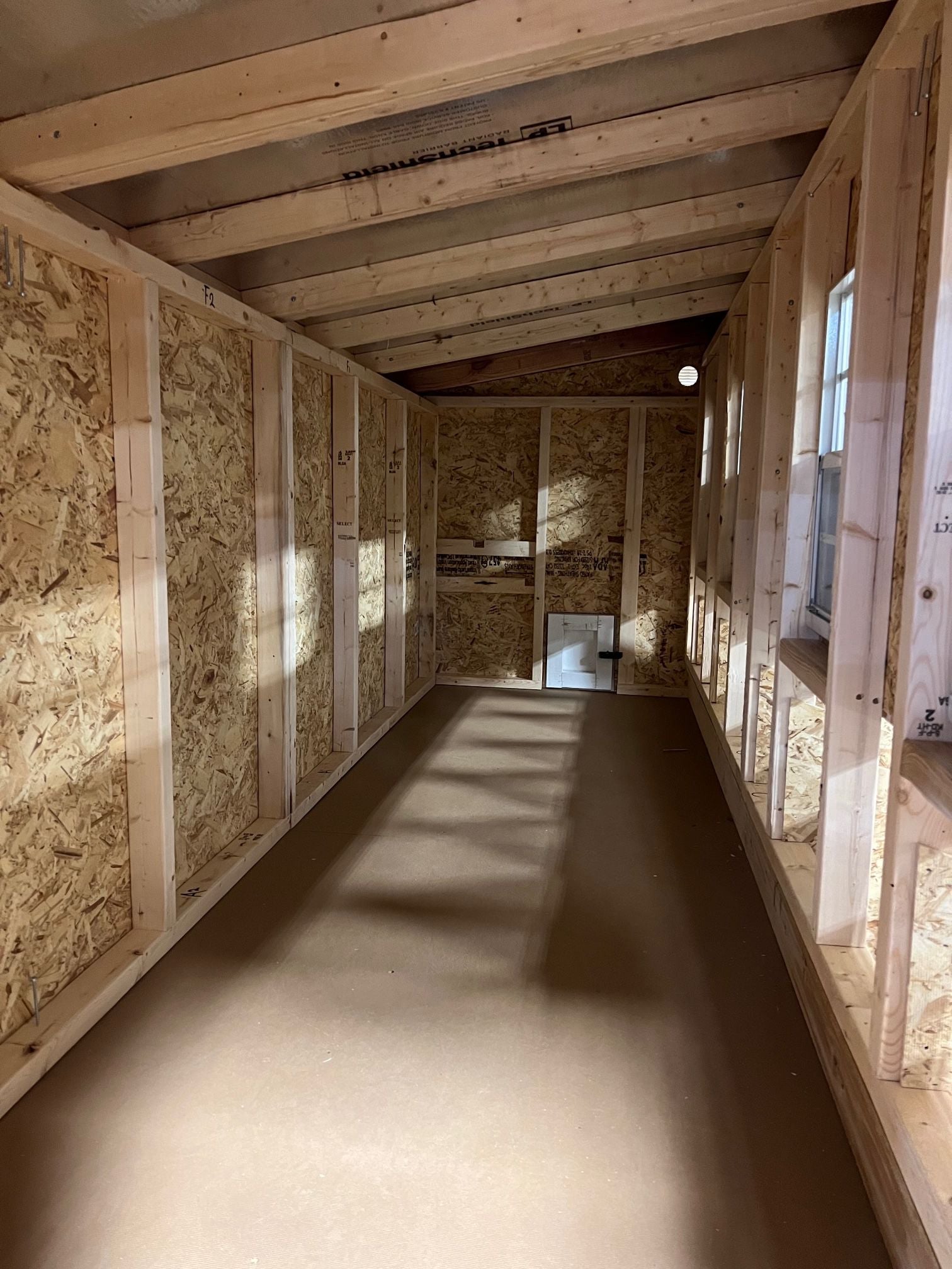 Interior view of the OverEZ Jumbo Chicken Coop designed for up to 30 chickens, featuring spacious nesting and roosting areas.
