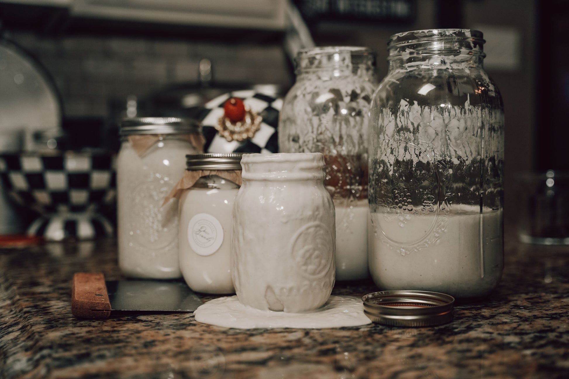 Dehydrated sourdough starter in a small jar, produced by Onic Brands LLC, ready for rehydration and baking.
