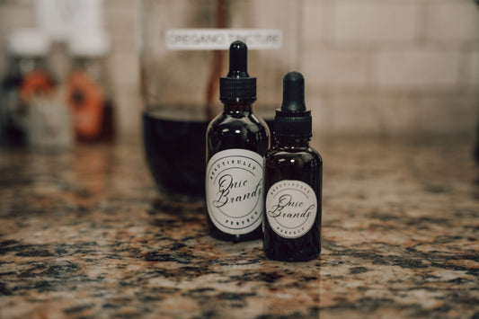 Onic Brands Elemental Oregano tincture bottle with dropper cap, natural herbal supplement for health support.