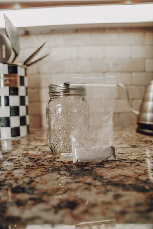 Dehydrated sourdough starter in a jar, produced by Onic Brands LLC, ready for rehydration and baking bread.
