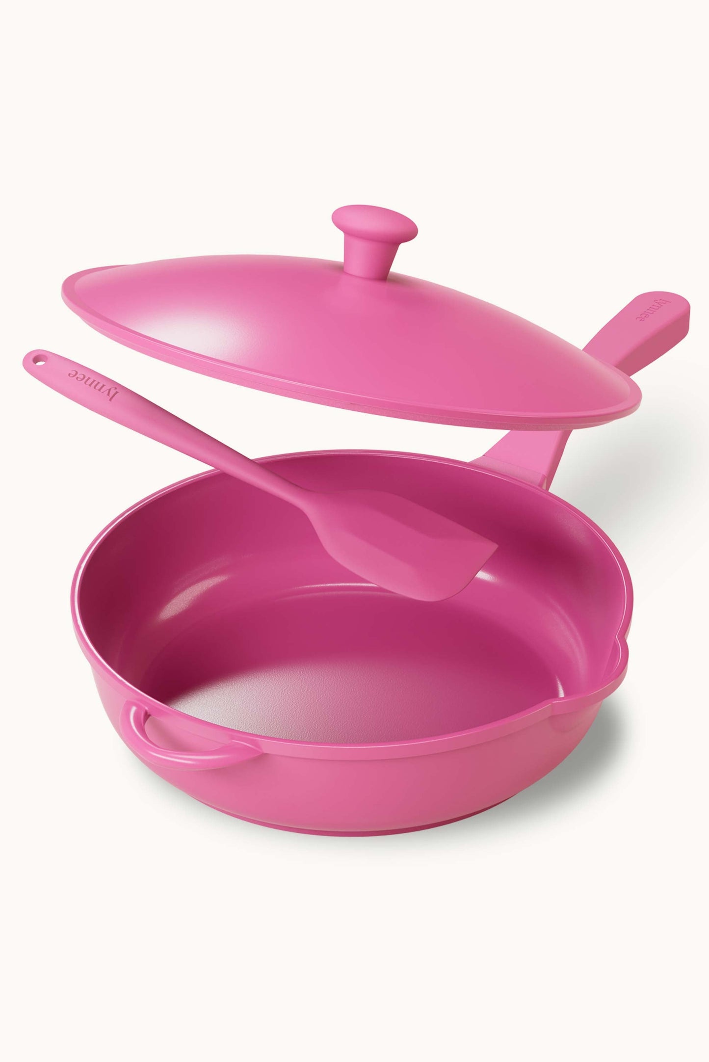 Lynnee 11-inch pink frying pan with non-stick surface, metal handle, and cooking surface visible for versatile kitchen use.