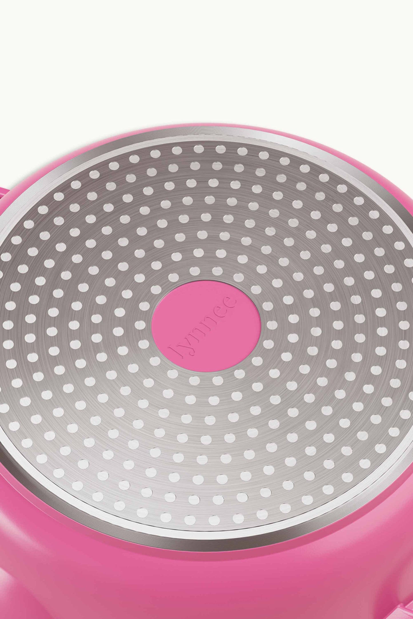 Pink 11-inch Lynnee frying pan with a smooth non-stick surface, shown from a top view with the handle visible.
