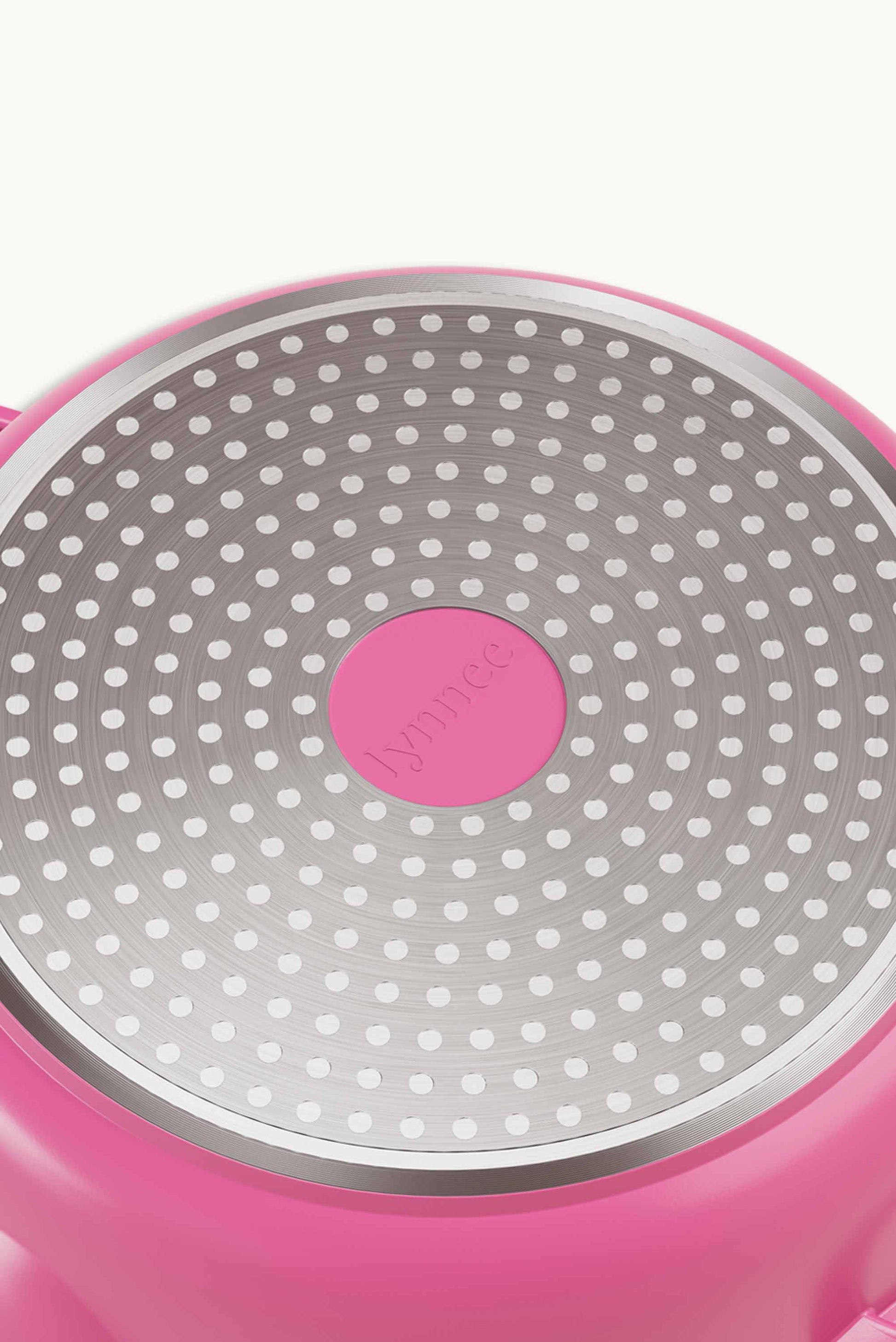 Pink 11-inch Lynnee frying pan with a smooth non-stick surface, shown from a top view with the handle visible.