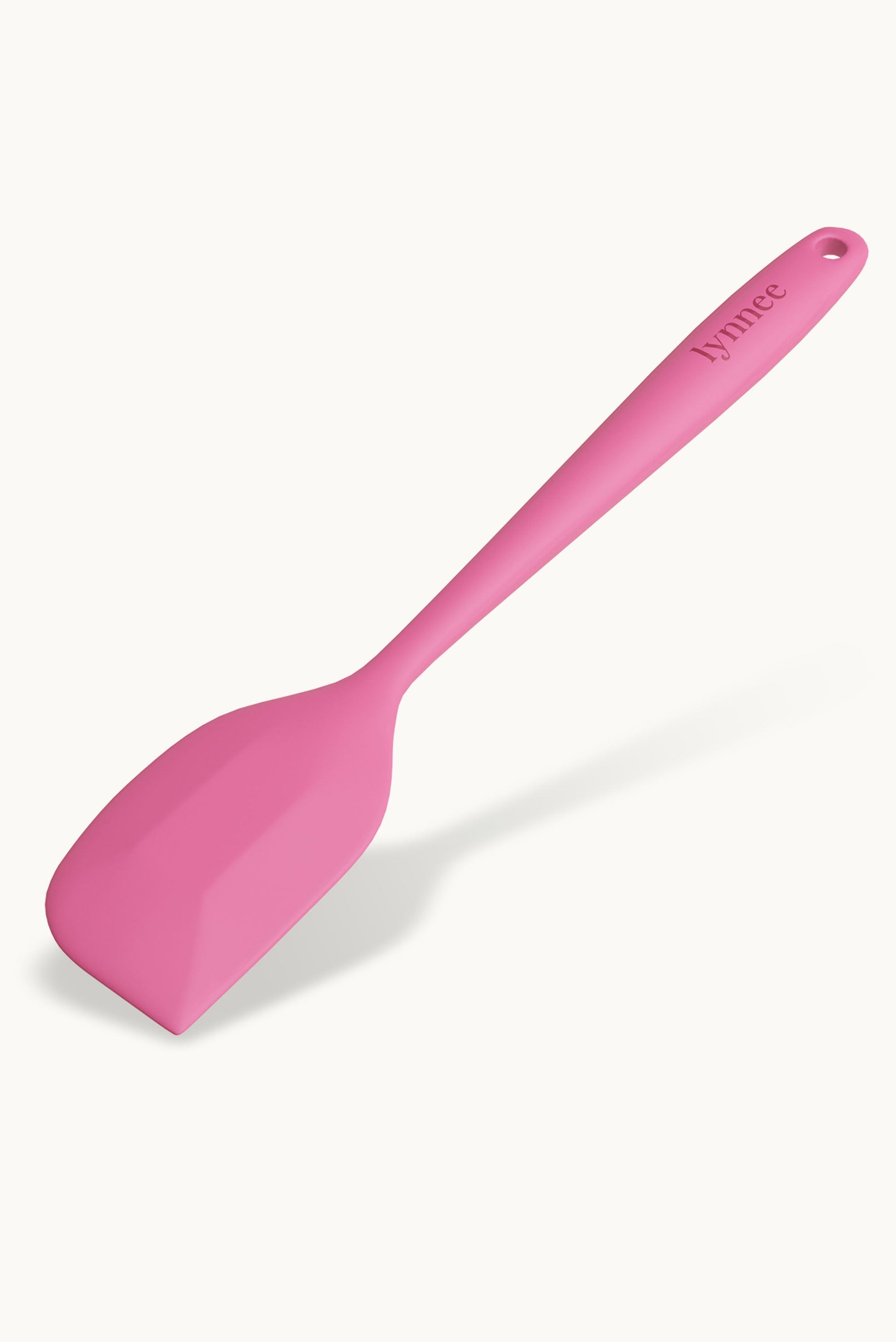 Lynnee 11-inch pink frying pan with a non-stick surface, shown with a smooth handle and a flat cooking surface.