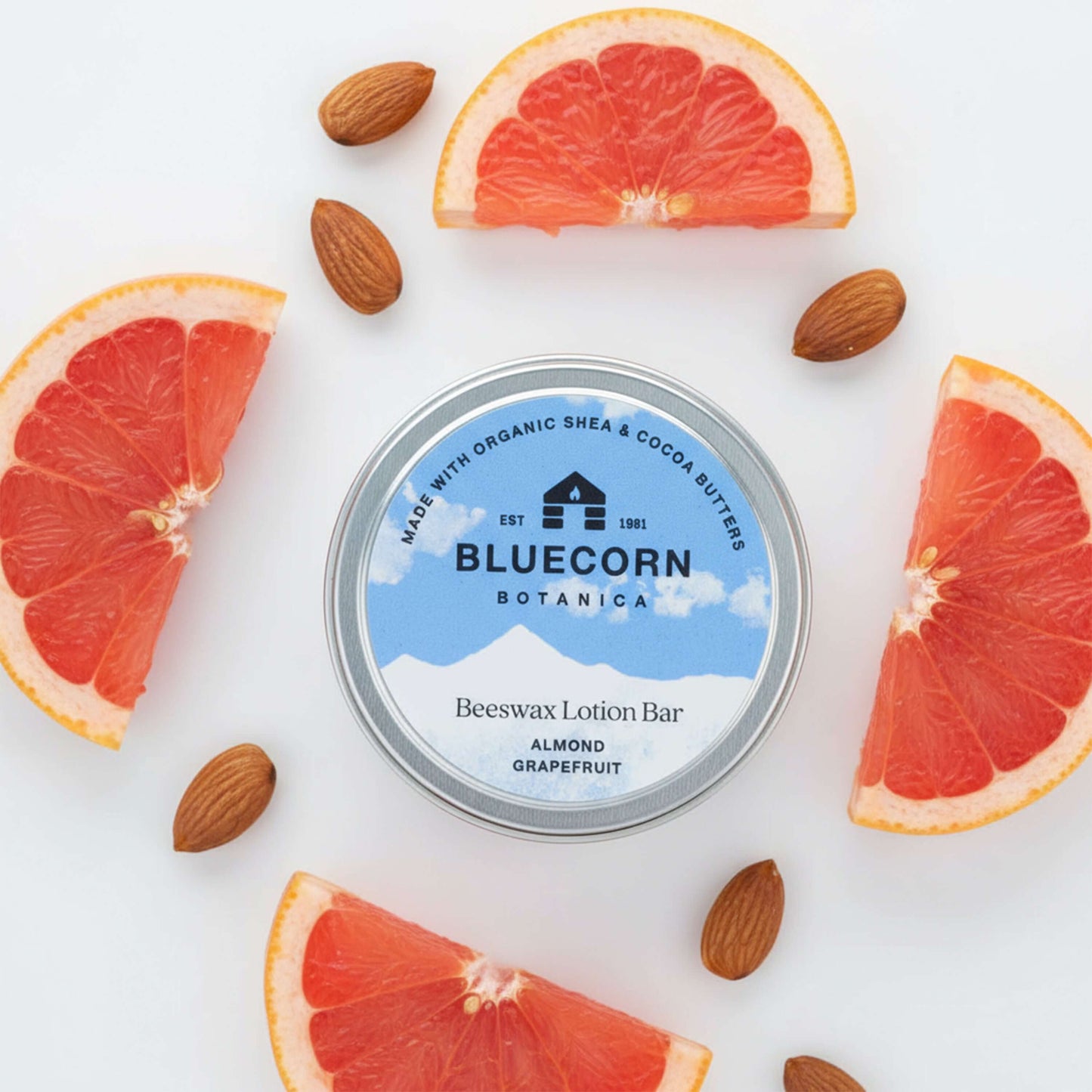 Bluecorn Beeswax Lotion Bar in grapefruit scent, apothecary-style Bluecorn Candles product, showing a round beeswax lotion bar.