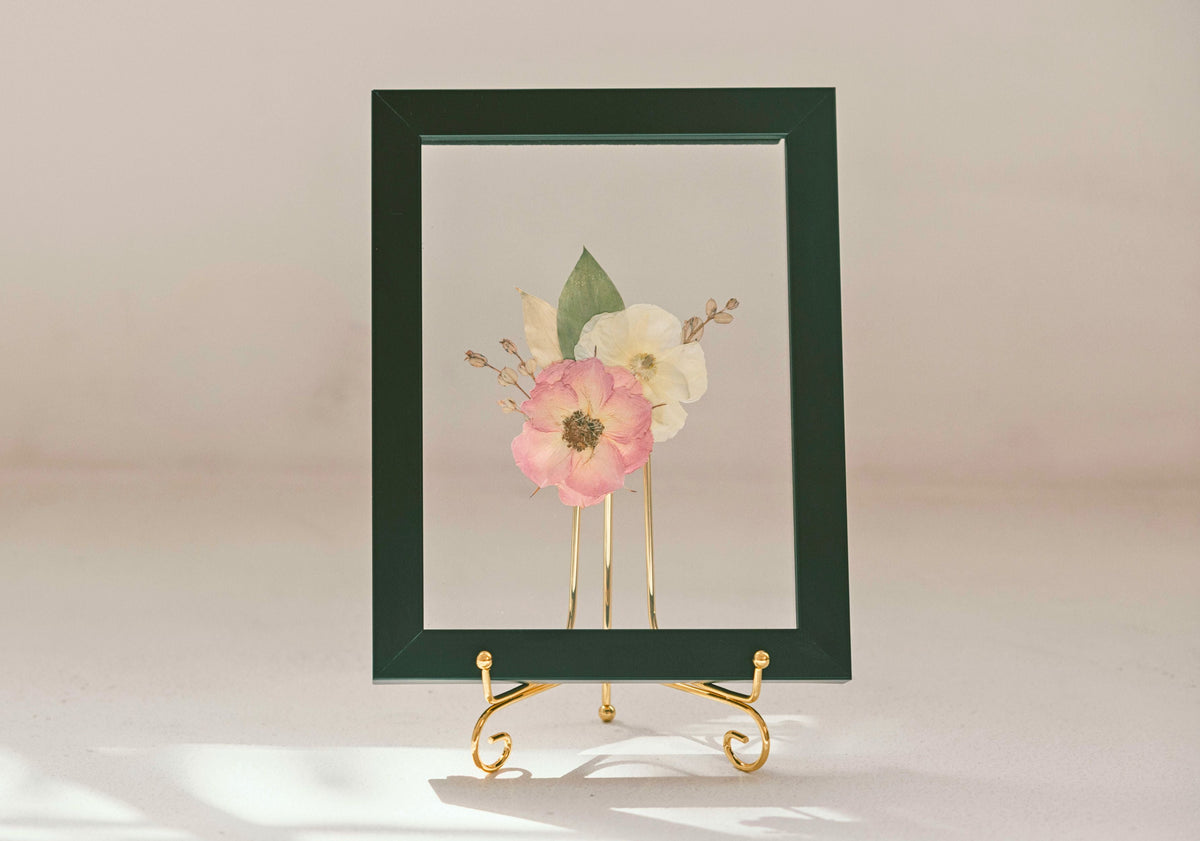 Pressed Floral boutonniere frame with a delicate pressed flower arrangement, perfect for showcasing floral designs.