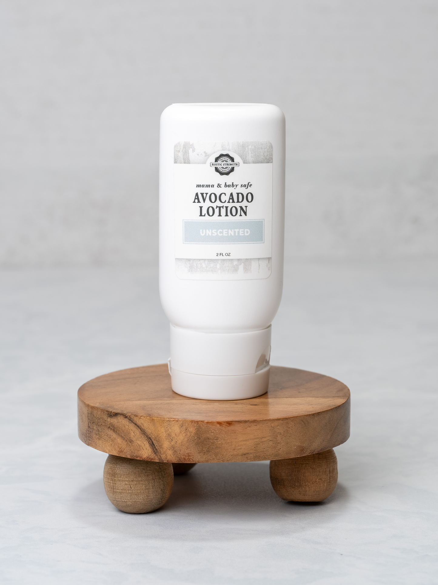 Rustic Strength Mama + Baby 2 oz travel kit with bath and body lotion, featuring a small, portable 2-ounce bottle and charming packaging.