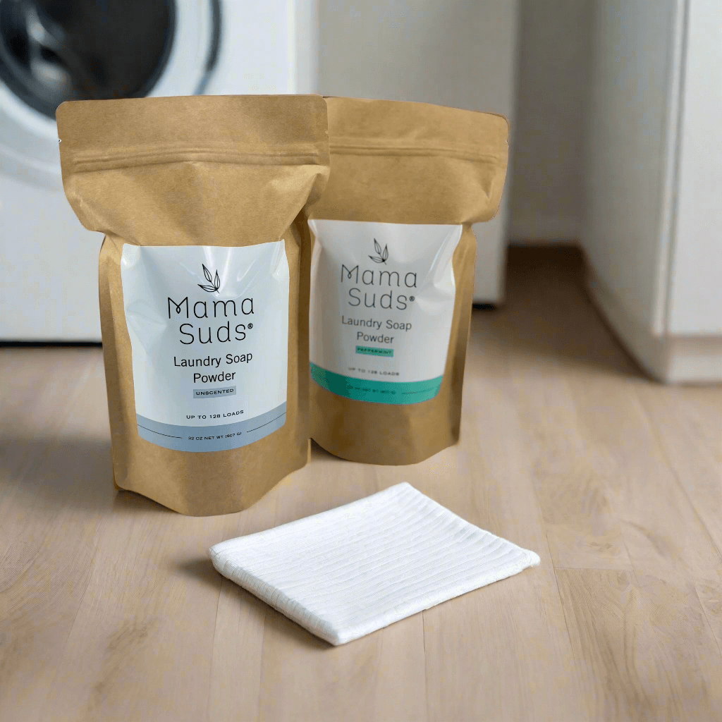 MamaSuds laundry soap powder in a white container with a green label for household cleaning.