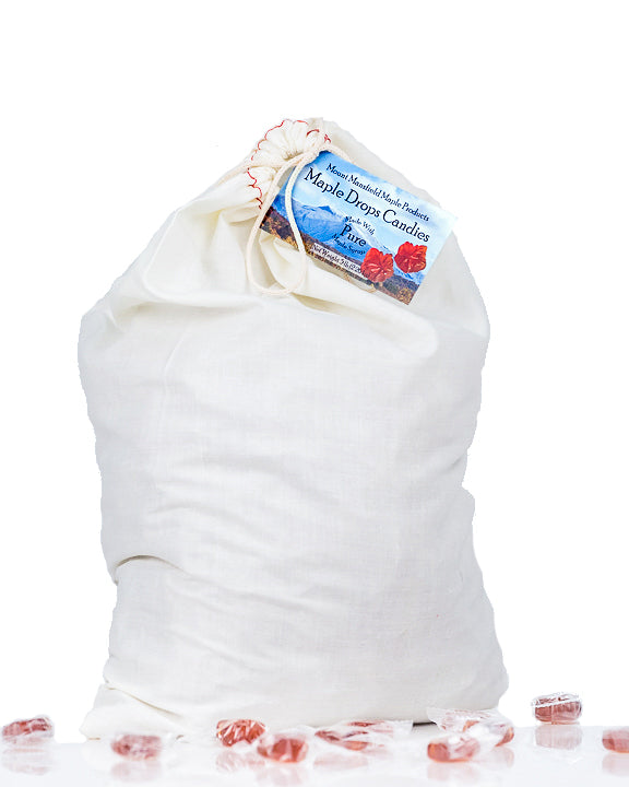 Assorted Mount Mansfield Maple Drops Hard Candy in a clear bag, showcasing shiny, golden maple candy pieces.