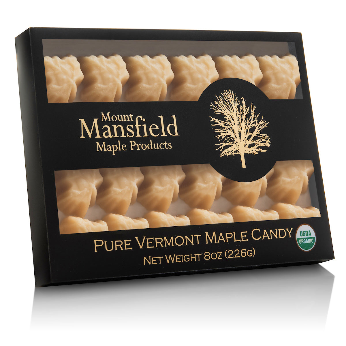 Organic pure maple sugar candy from Mount Mansfield Maple Products, showcasing a golden, glossy maple candy piece.