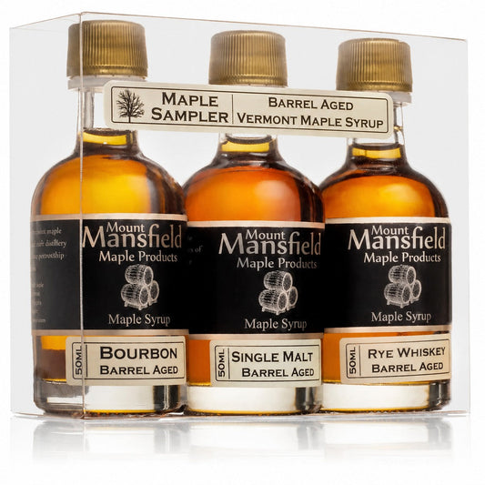 Three bottles of barrel aged Vermont maple syrup from Mount Mansfield Maple Products in a sampler set.