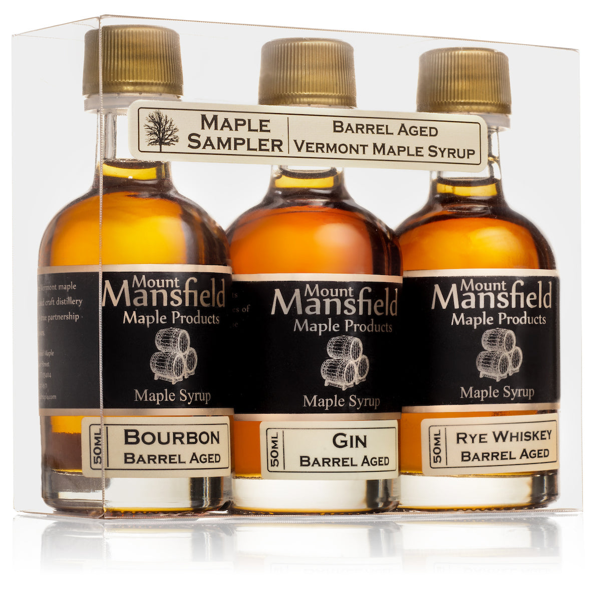 Three bottles of barrel aged Vermont maple syrup from Mount Mansfield Maple Products in a sampler set.