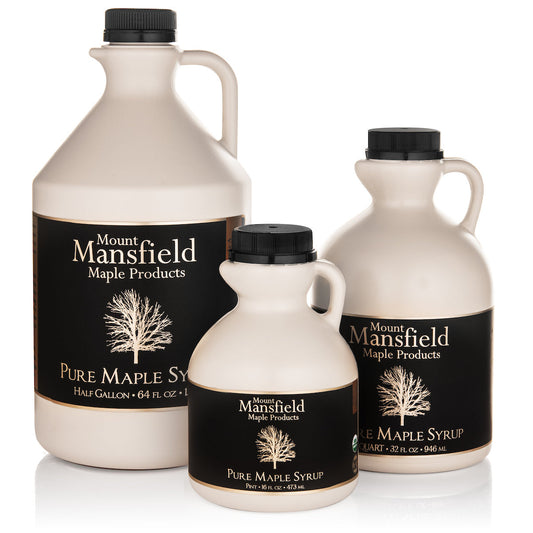 Organic Vermont Maple Syrup in a plastic jug from Mount Mansfield Maple Products, showcasing the syrup's rich amber color.