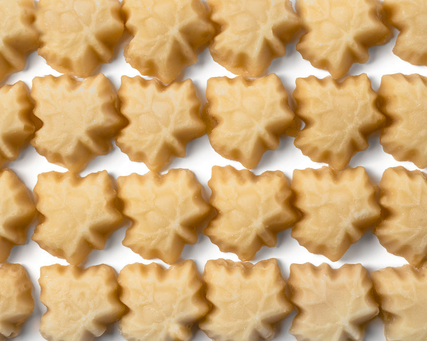 Close-up of Mount Mansfield Maple Products organic pure maple sugar candy showing glossy, amber-colored maple candy pieces.