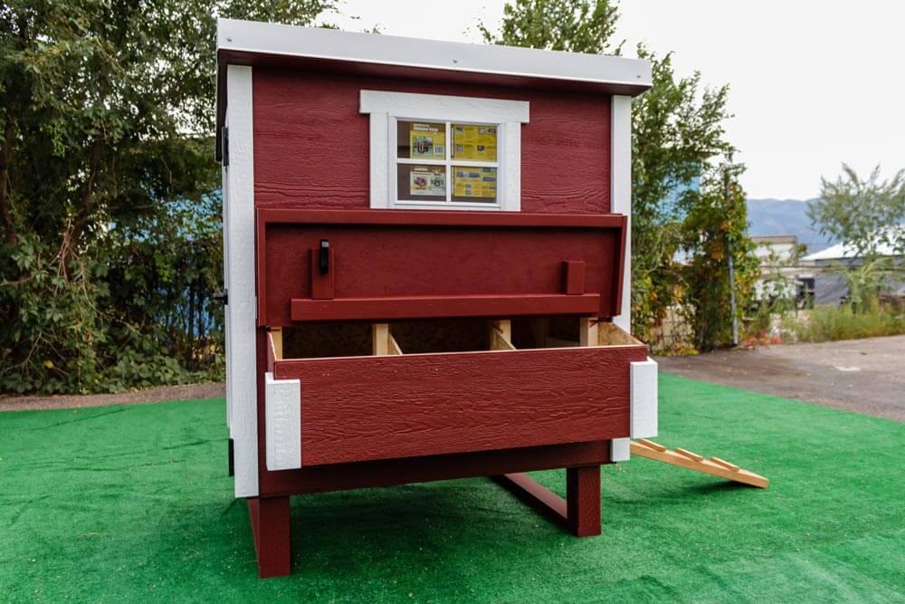 Medium OverEZ Chicken Coop for up to 10 chickens, front view showing sturdy wooden construction and secure door.