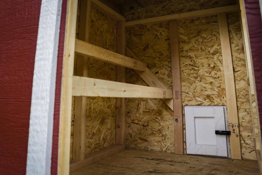 OverEZ medium chicken coop with roosting bars, designed to comfortably house up to 10 chickens in a durable outdoor shelter.