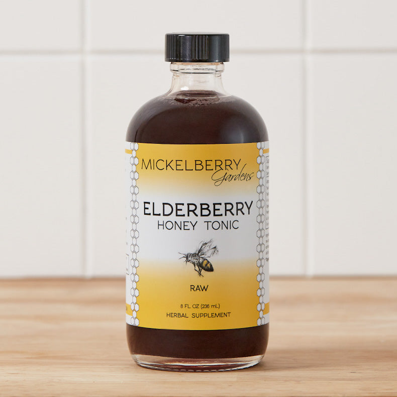 8oz bottle of Mickelberry Gardens Elderberry Honey Tonic, a natural honey-based health tonic with elderberry extract.