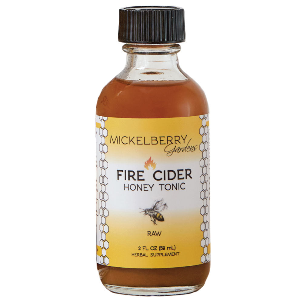 2oz bottle of Mickelberry Gardens Fire Cider Honey Tonic with honey and herbal ingredients in a clear glass bottle.
