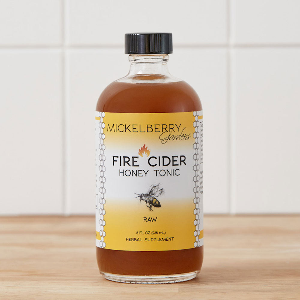 8oz bottle of Mickelberry Gardens Fire Cider Honey Tonic, a wellness honey tonic with fiery infusion and natural ingredients.