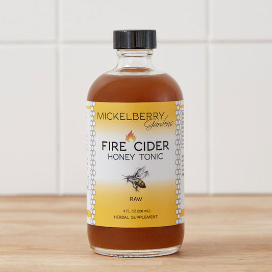 8oz bottle of Mickelberry Gardens Fire Cider Honey Tonic, a wellness honey tonic with fiery infusion and natural ingredients.