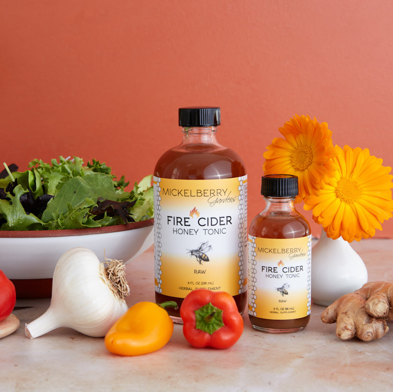 Mickelberry Gardens Fire Cider Honey Tonic in a glass bottle, used as a flavorful honey tonic and salad dressing ingredient.