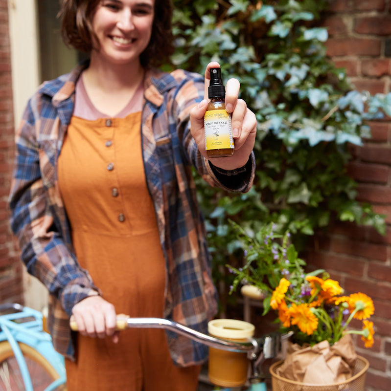 Mickelberry Gardens Honey Propolis Throat Spray in a natural Honey Tonic bottle, with a clear label and a spray nozzle.