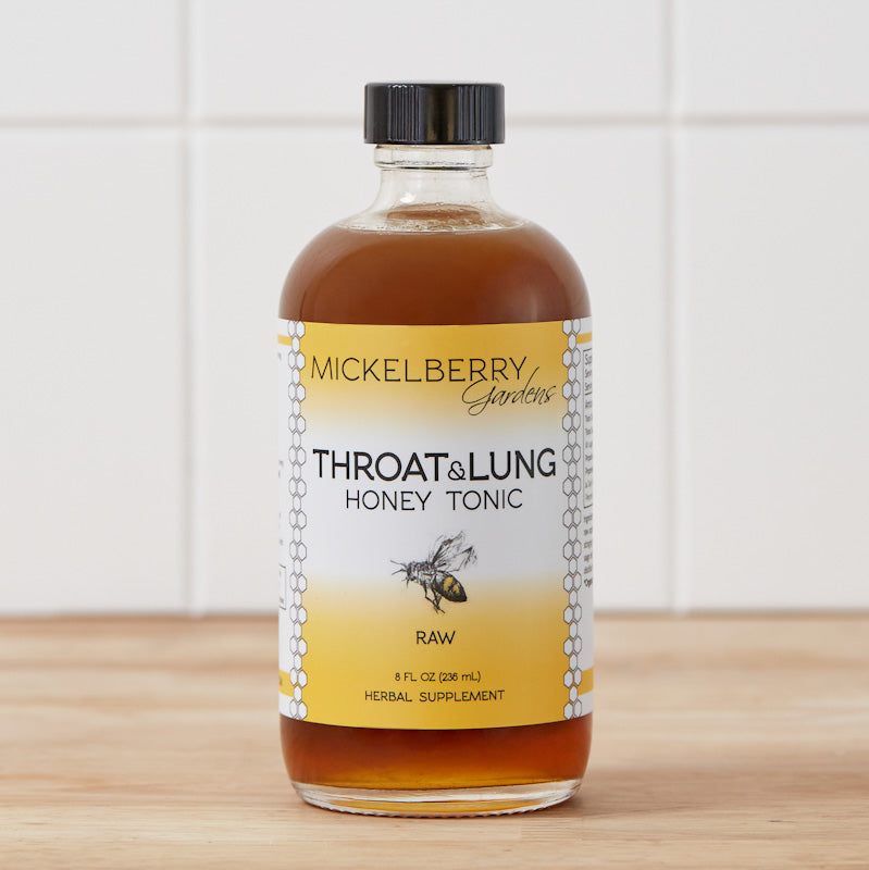 8oz bottle of Mickelberry Gardens Throat and Lung Honey Tonic with honey, herbs, and natural ingredients in a clear glass bottle.