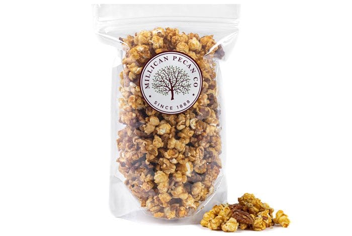 Millican Pecan caramel pecan popcorn bag, 12oz, featuring crunchy pecans and rich caramel coating in a snack bag.