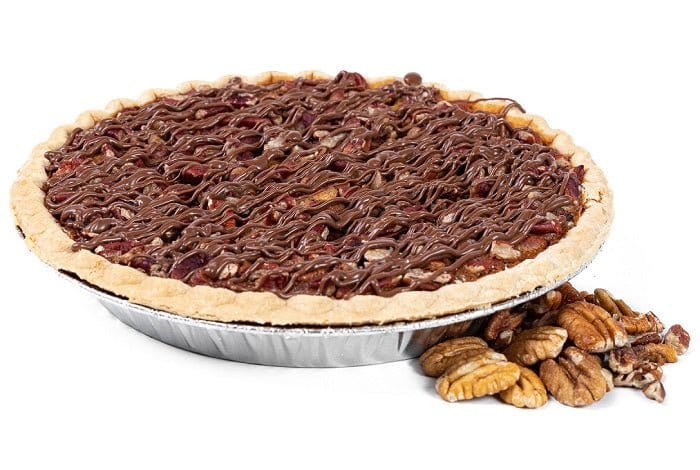Millican Pecan Chocolate Pecan Pie topped with chocolate drizzle and pecans in a baked pie crust, ready to serve.